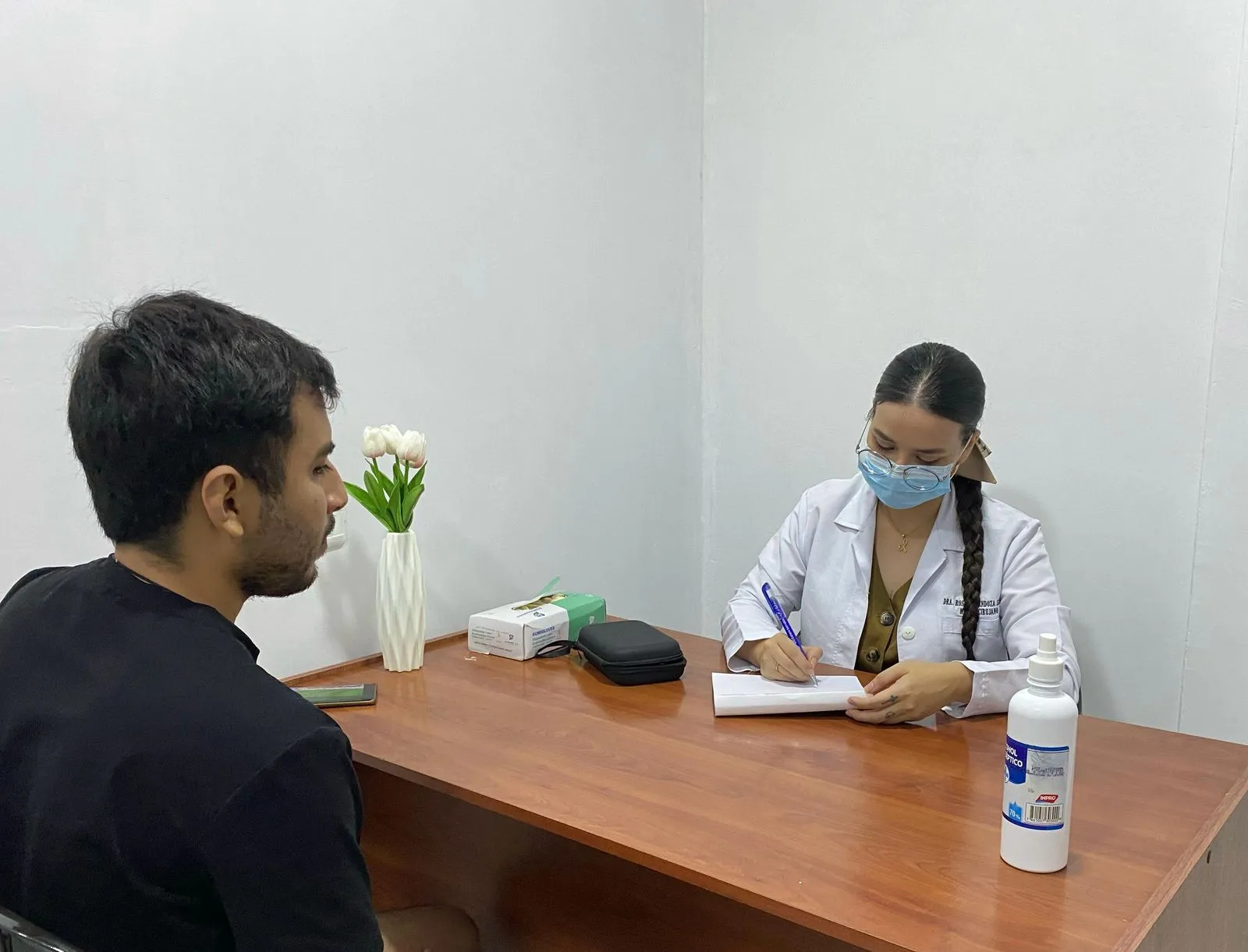 A doctor smiling to the camera